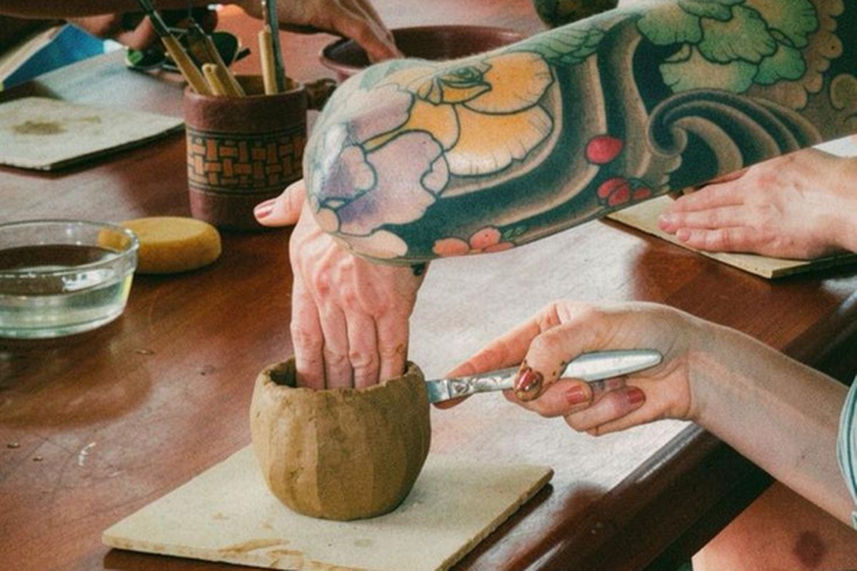 Hands shaping clay by hand at a pre-Columbian clay workshop in Pavones